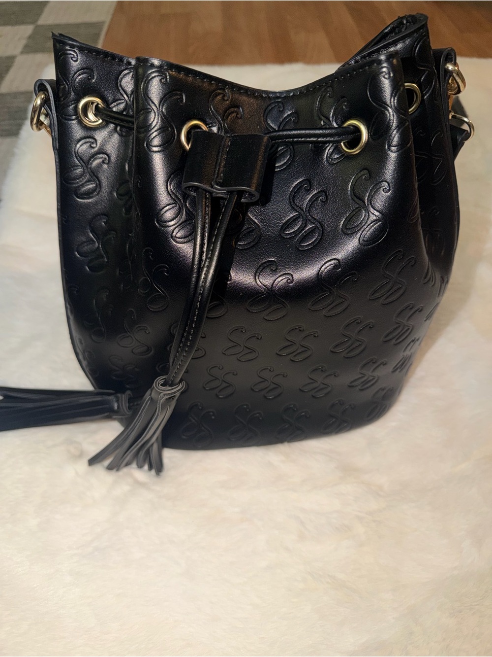 Black Embossed Drawstring Satchel with Tassel